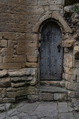 Old wooden door on Ruined English castle