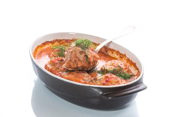 meatballs with tomato sauce on a white background