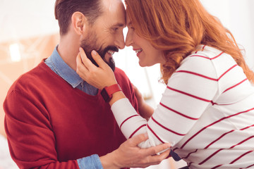 Forever together. Delighted mid aged couple expressing love while resting with her husband