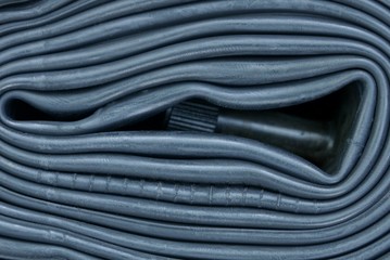 black rubber texture from bicycle chamber and nipple on roll