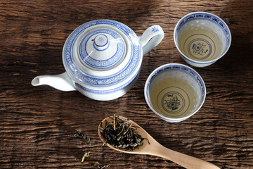 Tea pot and dry tea leaf.