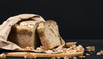 bread with crumbs on a wooden board