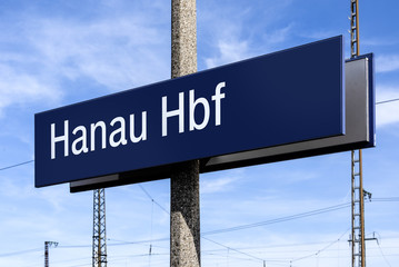 Germany, Hanau: Blue white sign of central main railroad station Hanau Hbf Hauptbahnhof - concept...