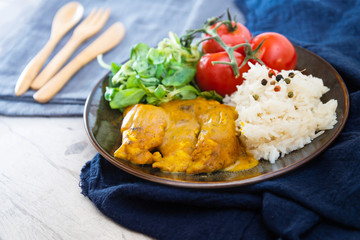 Rice and chicken on white plate