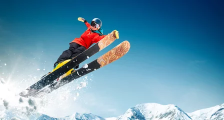 Tuinposter Skiing. Jumping skier. Extreme winter sports. © VIAR PRO studio