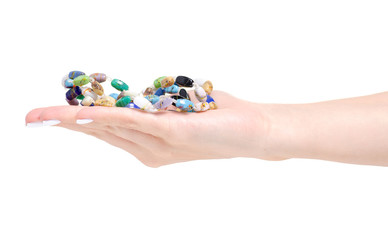 Beads colorful stones in hand on a white background isolation