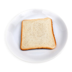Sliced white bread lies on a white plate on a white background. HDR