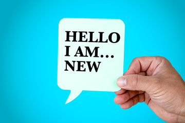 Hello I Am.New, presentation, self introduction concept. Paper speech bubble on blue background