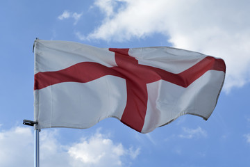 waving England national Flag in a sky.