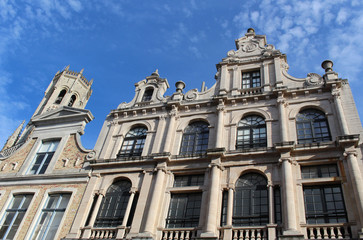 Fototapeta na wymiar Historical facades of houses and Bell tower of Belfry of Bruges, Belgium.