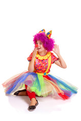 Happy young clown girl on white background