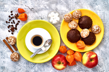 Obraz na płótnie Canvas Top view of hot coffee espresso with foam with sweets on the grey background. Tasty breakfast.