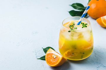 Refreshing clementine mocktail in glass. Selective focus, space for text.