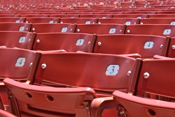 Fototapeta premium outdoor theater seating red bleacher numbered rows for audience