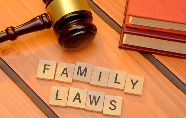 Family laws concept with gavel on wooden background