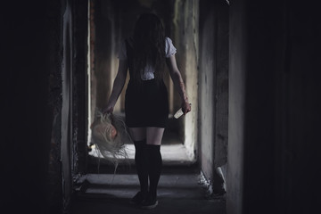 Fototapeta na wymiar Girl from horror movie with knife