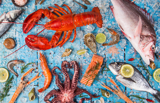 Fresh tasty seafood served on old wooden table.