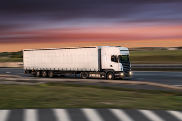 Truck with container on road, cargo transportation concept.