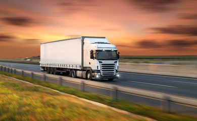 Truck with container on road, cargo transportation concept.