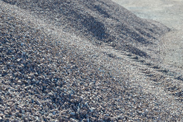 Breakstone background. Road gravel. Gravel texture. Crushed Gravel background. Piles of limestone rocks. Break stones on construction site.