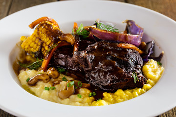 juicy portions of grilled fillet steak on dark background