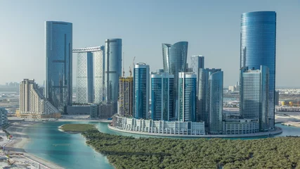 Papier Peint photo Abu Dhabi Buildings on Al Reem island in Abu Dhabi timelapse from above.