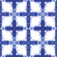 Fototapeta premium Seamless pattern, abstract tie dyed fabric of indigo color on white cotton. Hand painted fabrics. Shibori dyeing