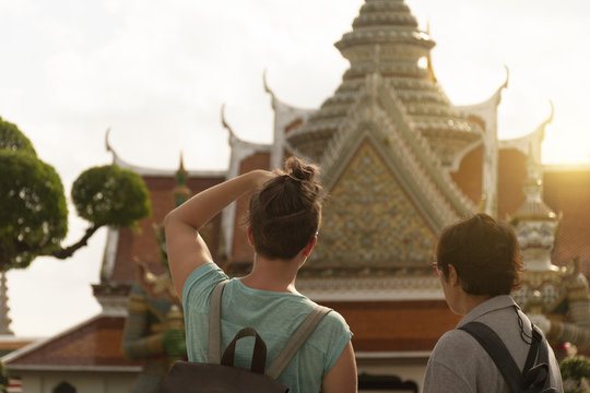 Tourists are sightseeing inside Wat Arun in Bangkok, Thailand.