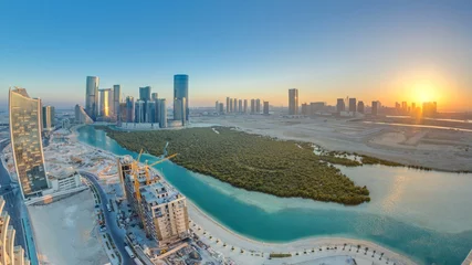 Wall murals Abu Dhabi Buildings on Al Reem island in Abu Dhabi at sunset timelapse from above.