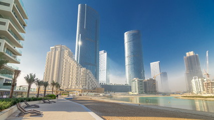 Obraz na płótnie Canvas Buildings on Al Reem island in Abu Dhabi timelapse hyperlapse