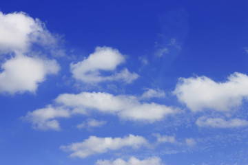 Naklejka na ściany i meble Idyllic white cloud on blue sky. Cloudscape background with fluffy cloud on blue summer sky wallpaper texture