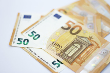 Fifty euro banknotes spread out isolated on white