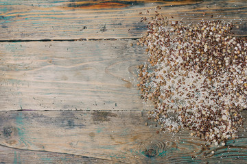 Gluten free grains ( brown rice, peas, flax seeds, lentils, white quinoa) on wooden background.