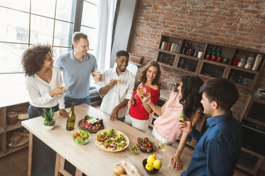 Overhead View Of Friends Enjoying Dinner Party At Home