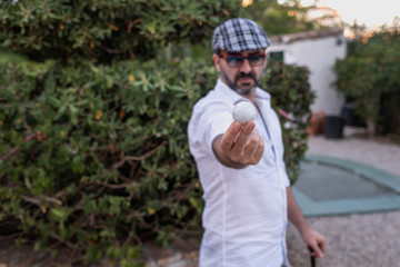Naklejka premium golf, green, mini golf, outdoors, young, mobile, person, portrait, telephone, phone, men, happy, park, holding, people, cell, white, smiling, handsome, nature, casual, one, communication, smile, guy, 