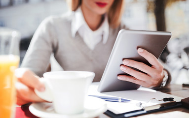 Business woman on coffee break in a cafe. Business, education, lifestyle concept