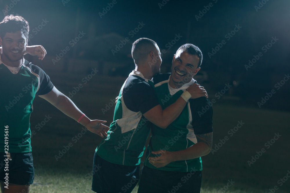 Wall mural hugs and smile after winning rugby game