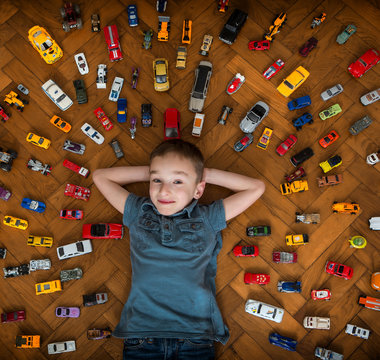 Boy with his toy car collection
