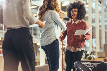 Business partners greeting each other at a meeting