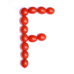The letter F is made of tomato. Symbol of the English alphabet of tomato on a white background.