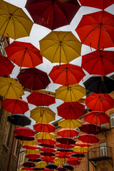 Fototapeta na wymiar QUEBEC CITY, QUEBEC / CANADA - JULY 14 2018: Colorful umbrellas on city street