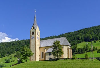 Fototapeta na wymiar village church on a hill