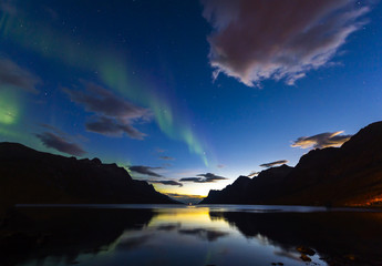 Fototapeta na wymiar The polar lights in Norway. TromsoюErsfjord