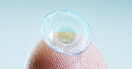 contact lens with digital and biometric implants to scan the ocular retina. concept of future and technology for digital scans.