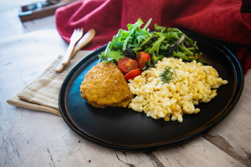 Escalope of spaghetti with tomatoes sauce and basil