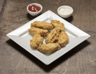 homemade crispy fried chicken on white