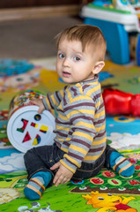 Little boy playing with toy cubes