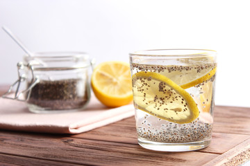 water with chia seeds and lemon in a glass. super food, proper nutrition, healthy supplements