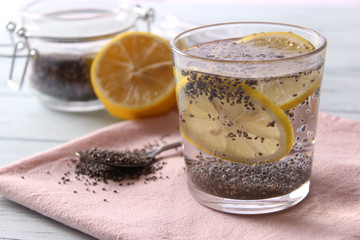 water with chia seeds and lemon in a glass. super food, proper nutrition, healthy supplements