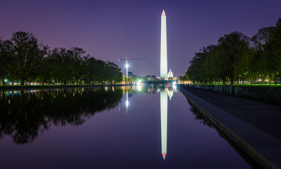 The Washington Monument at night with reflection in Lincoln Memorial Reflectig Pool in Washington D.C, USA